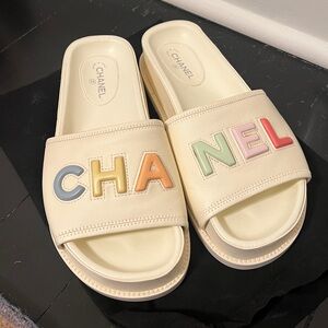 CHANEL Cream Leather Slide Sandals with Pastel Multicolor Logo
